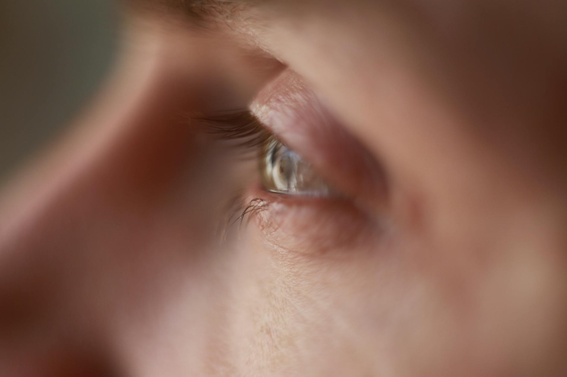 unrecognizable person with sad eyes in daytime