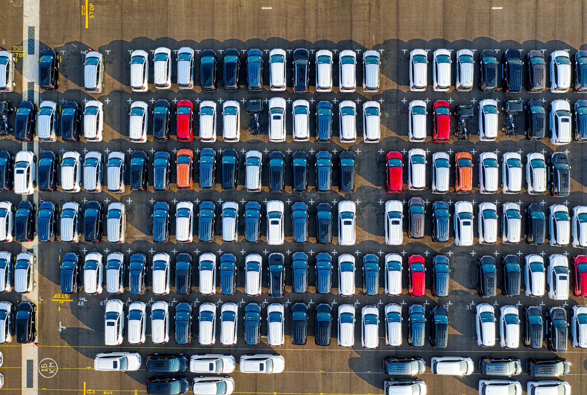 rows of different cars at parking lot